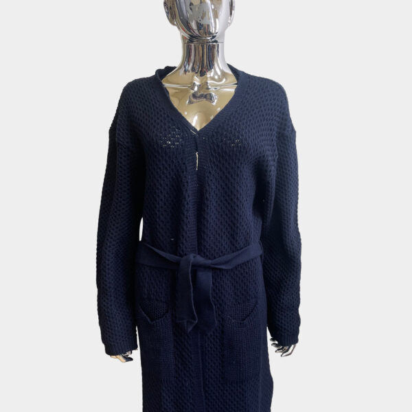 Long knitted belt cardigan in blue color for women against solid grey background