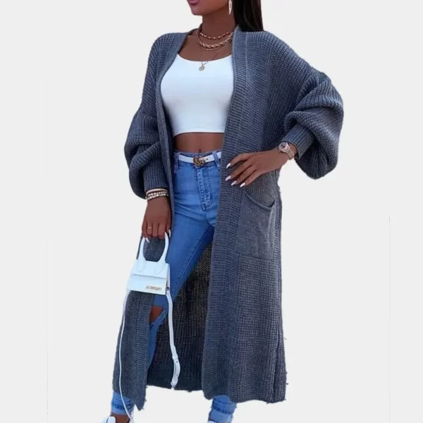 Black women wearing charcoal colored oversized balloon sleeve long cardigan in grey background
