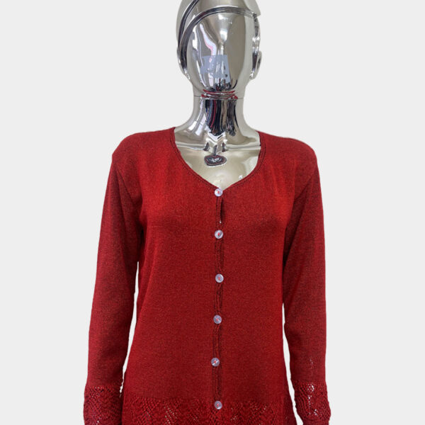 Ladies style knitted cardigan in red color against solid grey background