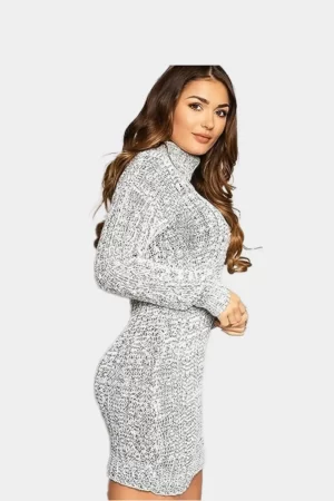 A woman wearing grey marl colored high polo neck chunky cable knitted mini tunic dress in grey background