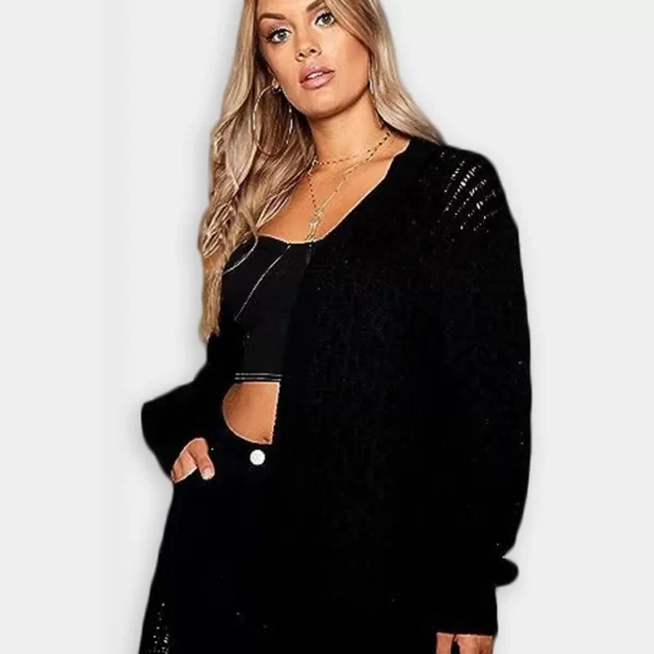 White woman wearing crochet knitted bolero shrug open cardigan in grey background